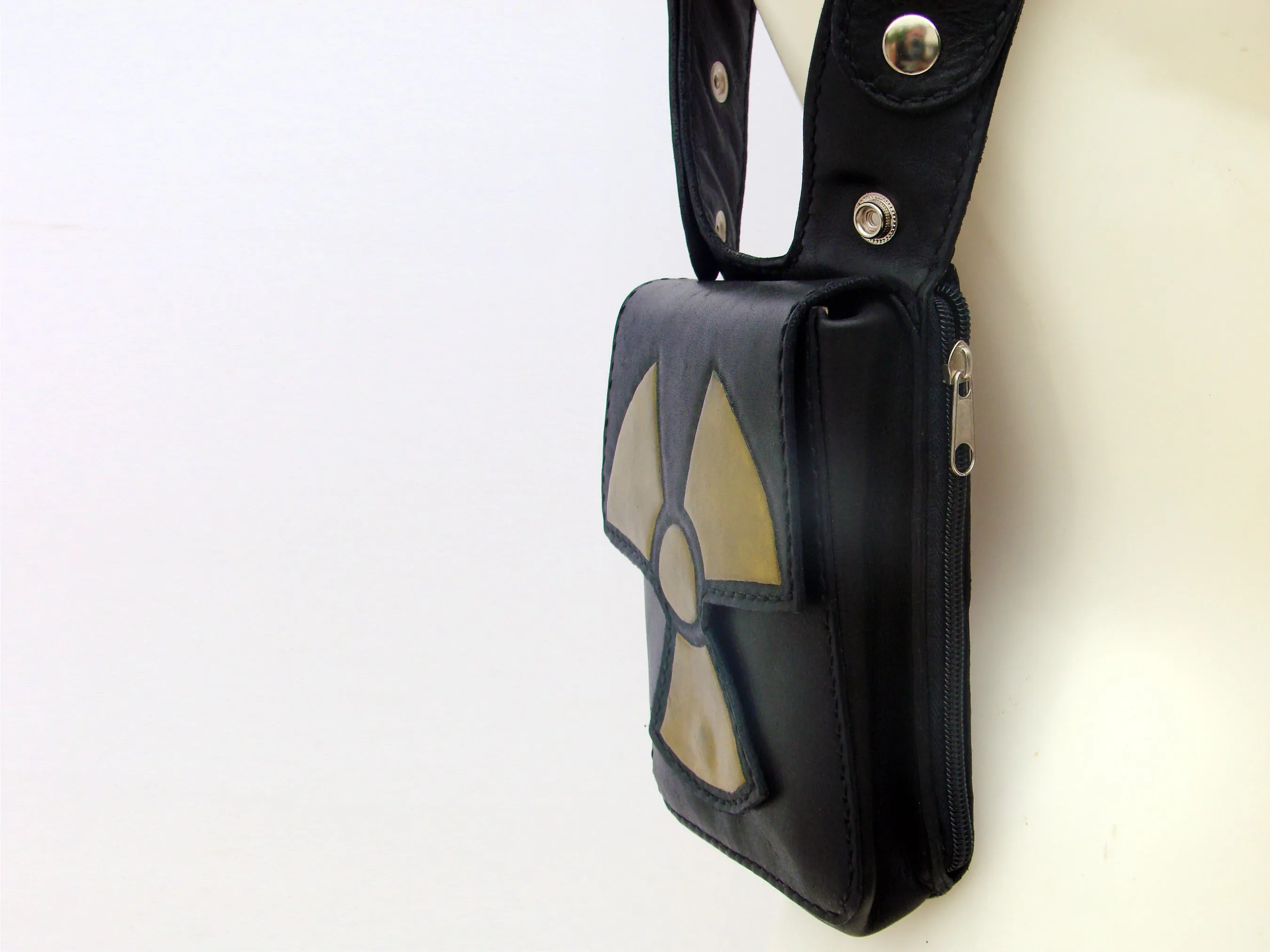 Rock & Rave in style with our leather double shoulder holster bag hand tooled radioactive symbol