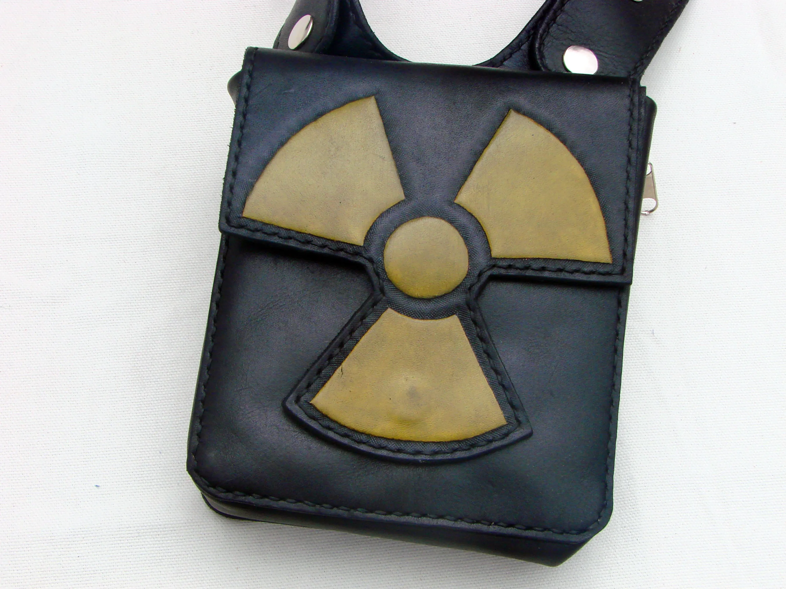 Rock & Rave in style with our leather double shoulder holster bag hand tooled radioactive symbol