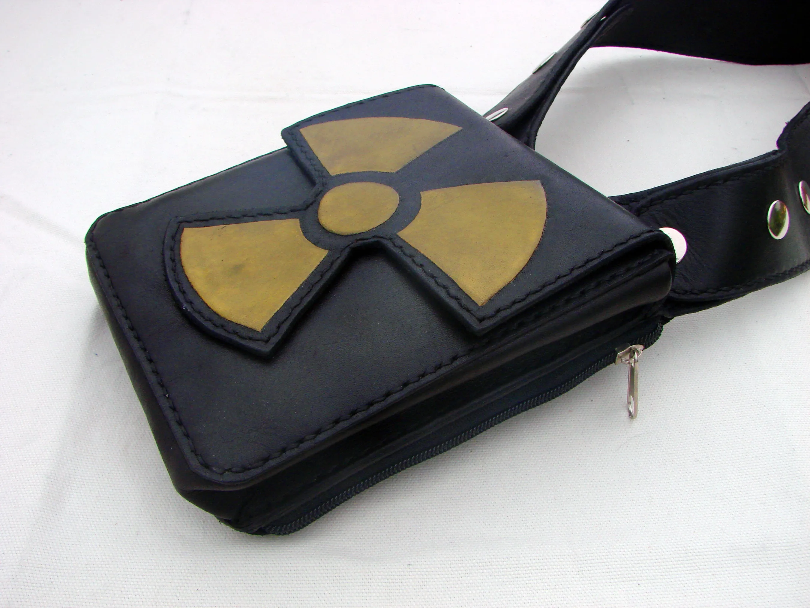 Rock & Rave in style with our leather double shoulder holster bag hand tooled radioactive symbol